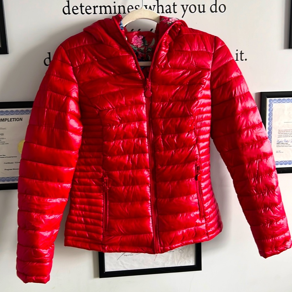 Red reversible lightweight puffer jacket.